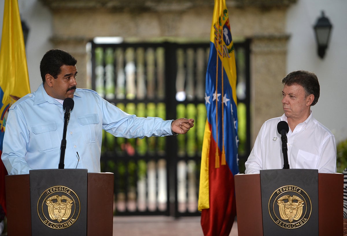 Los presidente Nicolás Maduro y Juan Manuel Santos / AFP