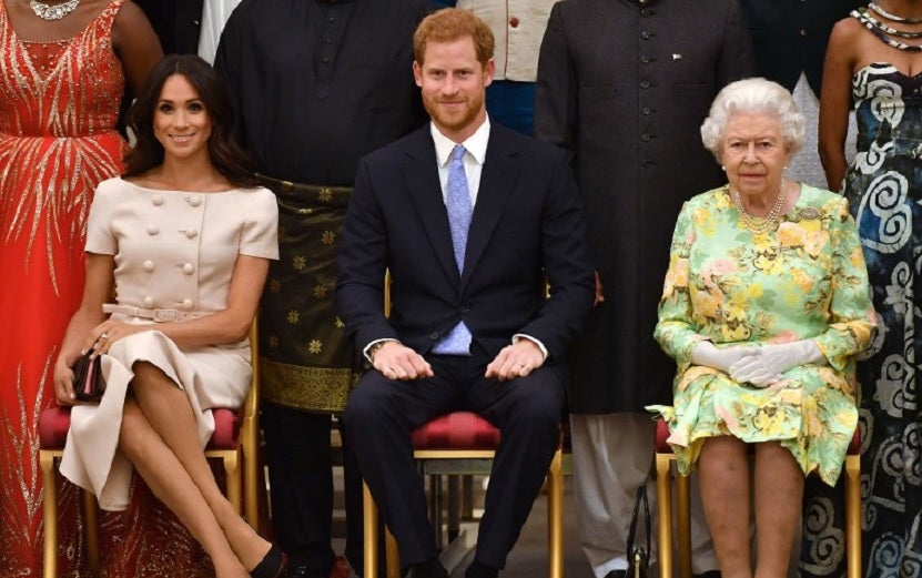 Reina Isabel II, príncipe Harry y Meghan Markle