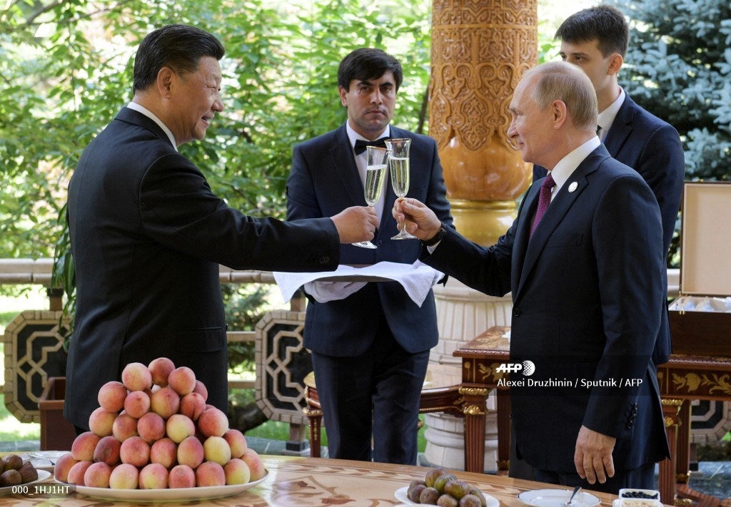 Vladimir Putin y Xi Junping