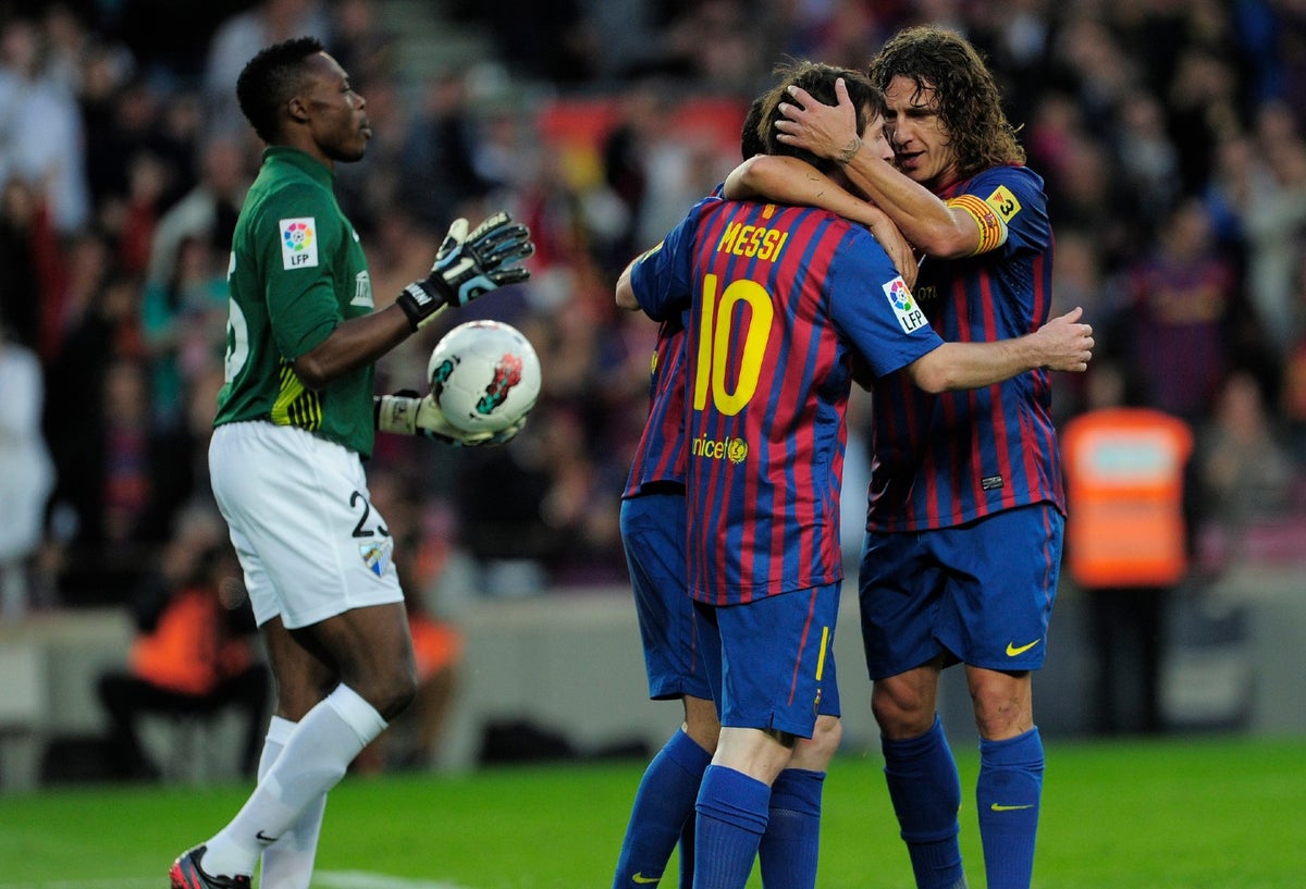 Puyol y Messi juntos en el Barcelona (2012)