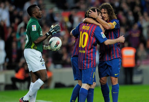 Puyol y Messi juntos en el Barcelona (2012)