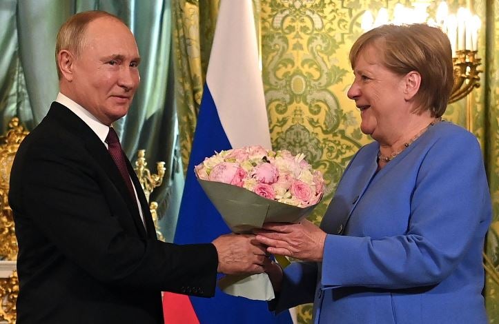 Vladimir Putin y Angela Merkel