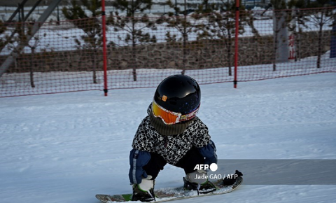 Wang Yuji en snowborad
