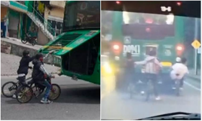 Ciclistas colgados de buses del SITP