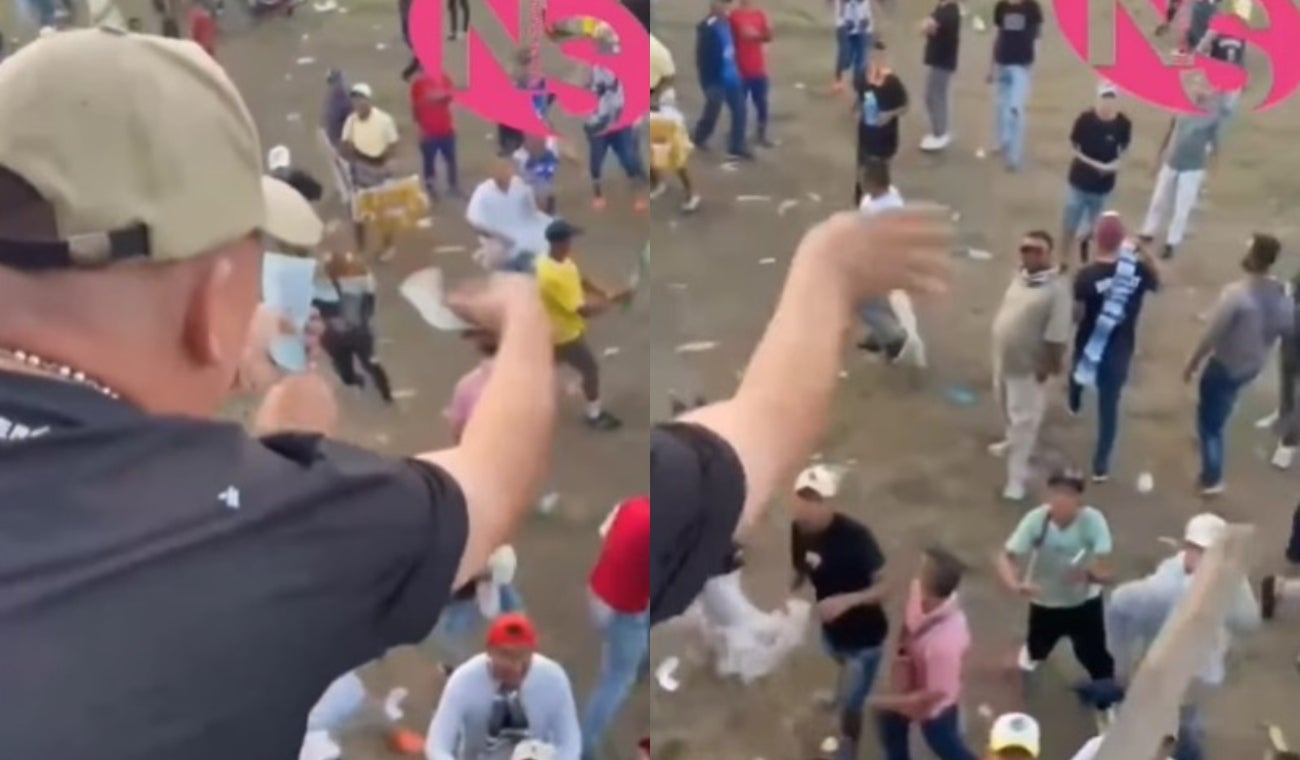 Hombre lanza dinero a corralejas
