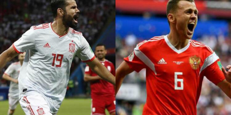 Diego Costa, delantero de España y Denis Cheryshev, volante de Rusia
