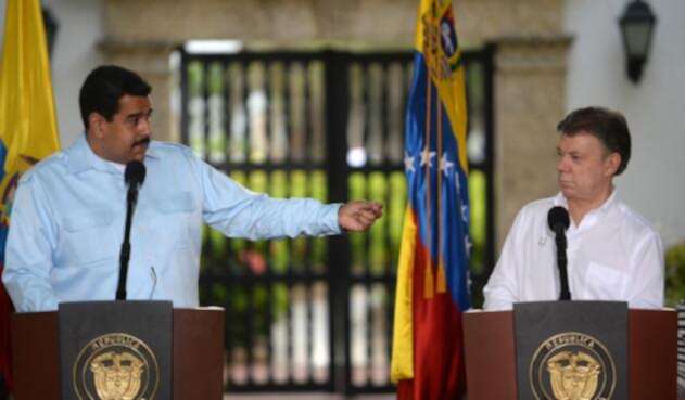 Los presidente Nicolás Maduro y Juan Manuel Santos / AFP Los presidente Nicolás Maduro y Juan Manuel Santos / AFP