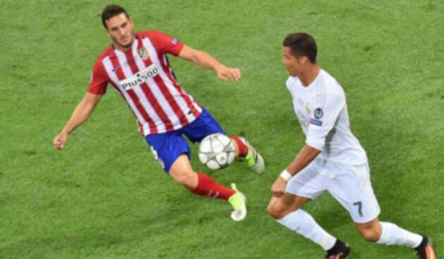 Koke contra Crisiano en un partido entre el Atlético y el Madrid