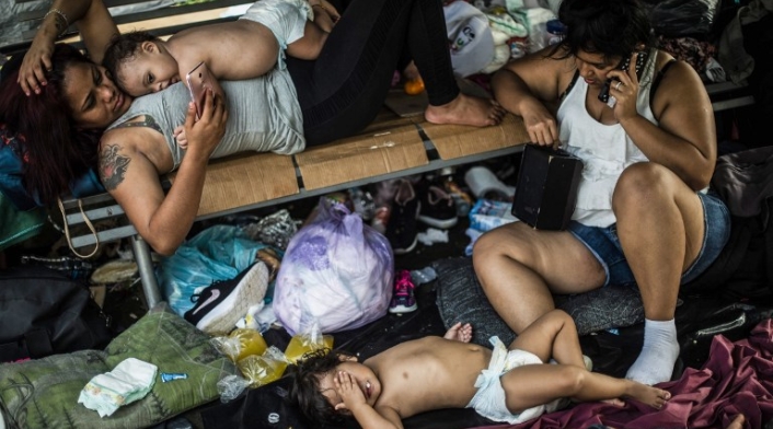 Niños caravana migrantes hondureños