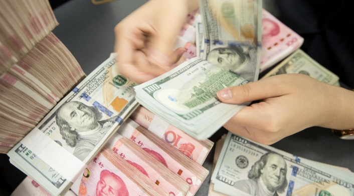 Dólar y Yuan Dólar y Yuan