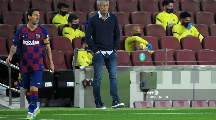 Quique Setién y Lionel Messi