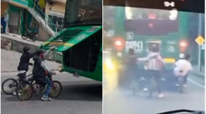 Ciclistas colgados de buses del SITP